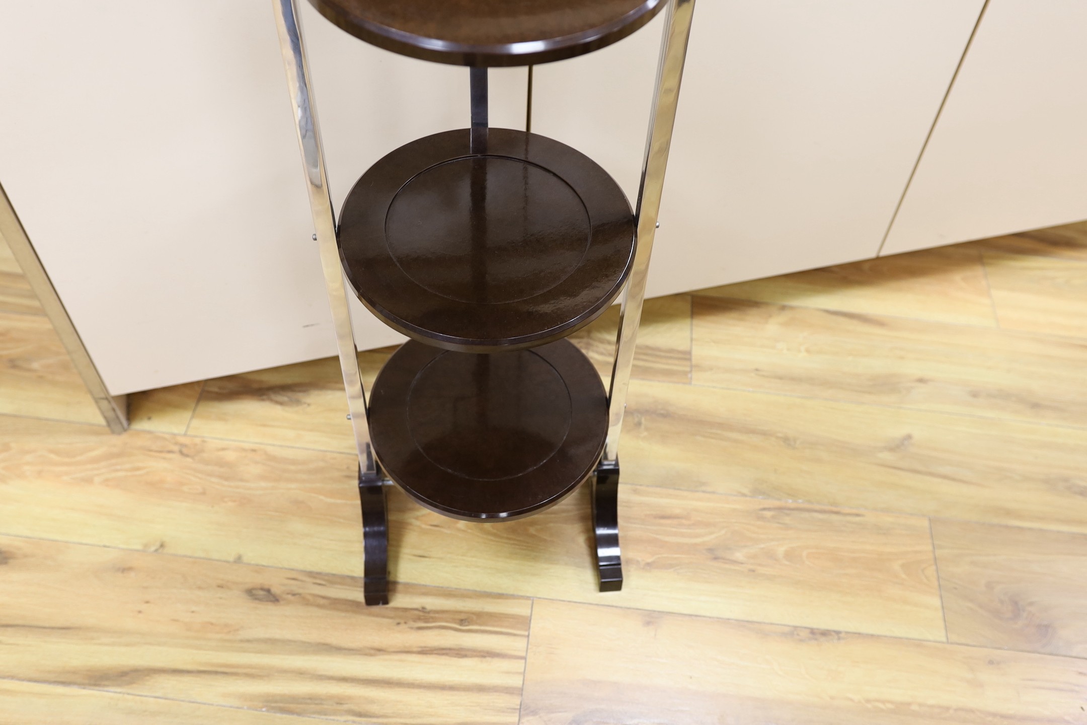 A Bakelite and chrome cake stand, 93cm